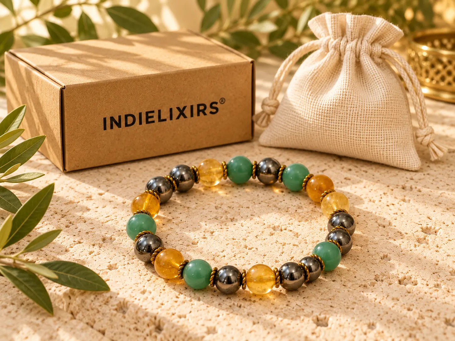 Wealth Bracelet beside its gift box and pouch
