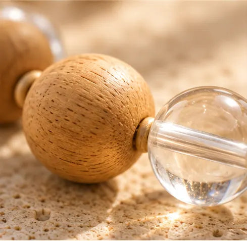 Close photograph of warm pale wooden beads